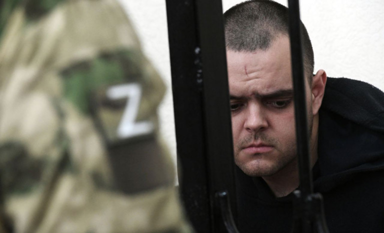 На заглавном фото: Британию мы запомнили – её олицетворением был Аслин Эйден, который сдался в плен российским войскам в Мариуполе, был приговорён к смертной казни в ДНР и избежал её только при посредничестве наследного принца Саудовской Аравии Мухаммеда ибн Салмана